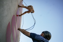 U.S. Marine Corps Drill Instructor, Sgt. Seth Wilson with Lima Company, 3rd Recruit Training Battalion, belay a Marine on the rappel tower at Marine Corps Recruit Depot San Diego, California, Jan. 10, 2025. The rappel tower provides opportunities for the new Marines to gain confidence in themselves and their gear and is one of the last training events Marines will conduct while at MCRD San Diego. Most ready when our nation is least ready, we train Marines to defeat the challengers, obstacles, and potential adversaries that hinder our nation’s progress and threaten our peace and security. (U.S. Marine Corps photo by Cpl. Sarah M. Grawcock)