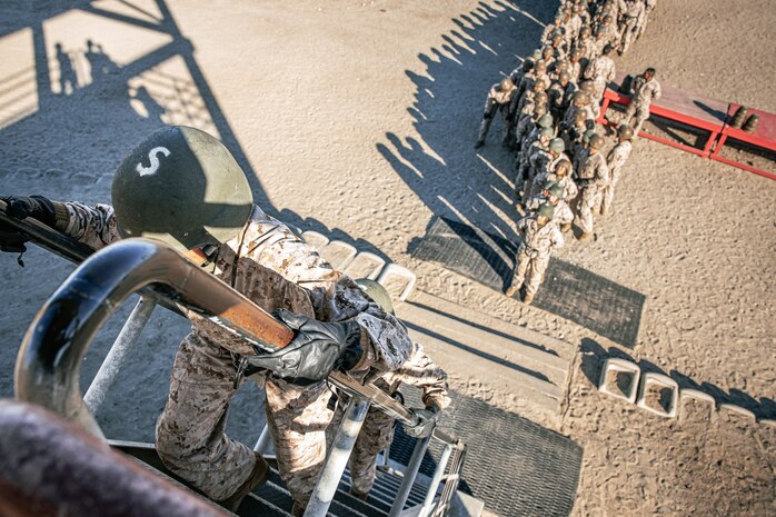 U.S. Marines with Lima Company, 3rd Recruit Training Battalion, ascend to the top of the rappel tower at Marine Corps Recruit Depot San Diego, California, Jan. 10, 2025. The rappel tower provides opportunities for the new Marines to gain confidence in themselves and their gear and is one of the last training events Marines will conduct while at MCRD San Diego. Most ready when our nation is least ready, we train Marines to defeat the challengers, obstacles, and potential adversaries that hinder our nation’s progress and threaten our peace and security. (U.S. Marine Corps photo by Cpl. Sarah M. Grawcock)