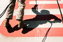 A U.S. Marine with Lima Company, 3rd Recruit Training Battalion, descends the rappel tower at Marine Corps Recruit Depot San Diego, California, Jan. 10, 2025. The rappel tower provides opportunities for the new Marines to gain confidence in themselves and their gear and is one of the last training events Marines will conduct while at MCRD San Diego. Most ready when our nation is least ready, we train Marines to defeat the challengers, obstacles, and potential adversaries that hinder our nation’s progress and threaten our peace and security. (U.S. Marine Corps photo by Cpl. Sarah M. Grawcock)