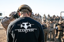 A U.S. Marine Corps helicopter rope suspension techniques master, with Support Battalion, Recruit Training Regiment, adjusts a Marine’s harness, with Lima Company, 3rd Recruit Training Battalion, prior to the rappel tower at Marine Corps Recruit Depot San Diego, California, Jan. 10, 2025. The rappel tower provides opportunities for the new Marines to gain confidence in themselves and their gear and is one of the last training events Marines will conduct while at MCRD San Diego. Most ready when our nation is least ready, we train Marines to defeat the challengers, obstacles, and potential adversaries that hinder our nation’s progress and threaten our peace and security. (U.S. Marine Corps photo by Cpl. Sarah M. Grawcock)