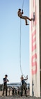 A U.S. Marine with Lima Company, 3rd Recruit Training Battalion, descends the rappel tower at Marine Corps Recruit Depot San Diego, California, Jan. 10, 2025. The rappel tower provides opportunities for the new Marines to gain confidence in themselves and their gear and is one of the last training events Marines will conduct while at MCRD San Diego. Most ready when our nation is least ready, we train Marines to defeat the challengers, obstacles, and potential adversaries that hinder our nation’s progress and threaten our peace and security. (U.S. Marine Corps photo by Cpl. Sarah M. Grawcock)