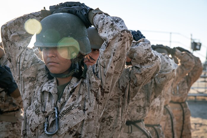 U.S. Marines with Lima Company, 3rd Recruit Training Battalion, wait to get their harness checked prior to the rappel tower at Marine Corps Recruit Depot San Diego, California, Jan. 10, 2025. The rappel tower provides opportunities for the new Marines to gain confidence in themselves and their gear and is one of the last training events Marines will conduct while at MCRD San Diego. Most ready when our nation is least ready, we train Marines to defeat the challengers, obstacles, and potential adversaries that hinder our nation’s progress and threaten our peace and security. (U.S. Marine Corps photo by Cpl. Sarah M. Grawcock)