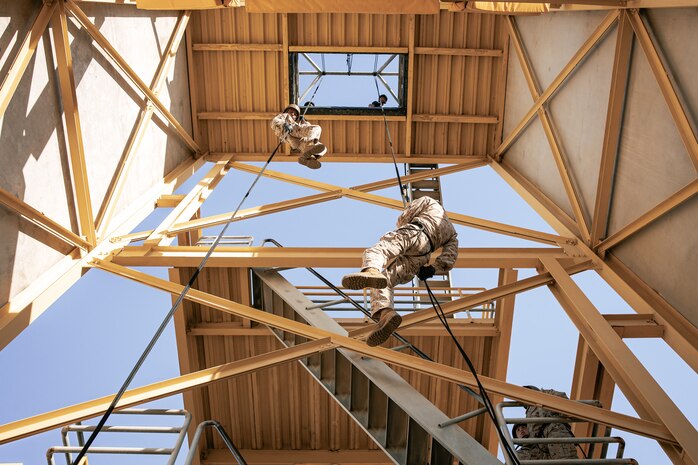 U.S. Marines with Lima Company, 3rd Recruit Training Battalion, descend the rappel tower at Marine Corps Recruit Depot San Diego, California, Jan. 10, 2025. The rappel tower provides opportunities for the new Marines to gain confidence in themselves and their gear and is one of the last training events Marines will conduct while at MCRD San Diego. Most ready when our nation is least ready, we train Marines to defeat the challengers, obstacles, and potential adversaries that hinder our nation’s progress and threaten our peace and security. (U.S. Marine Corps photo by Cpl. Sarah M. Grawcock)