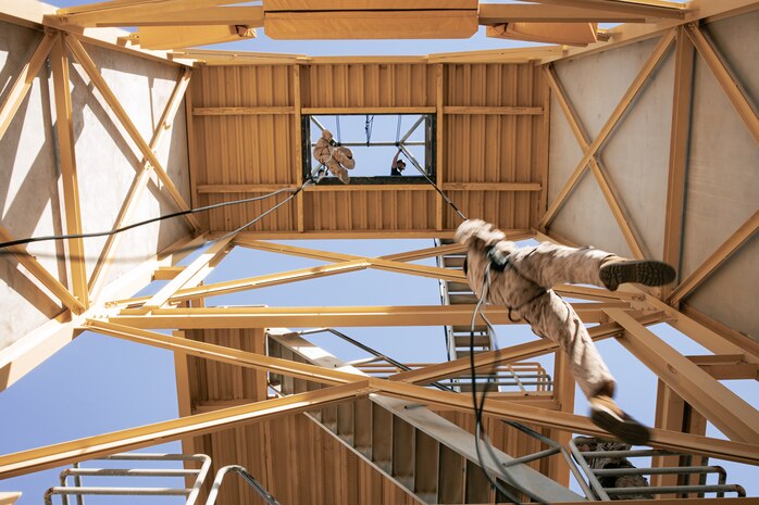 U.S. Marines with Lima Company, 3rd Recruit Training Battalion, descend the rappel tower at Marine Corps Recruit Depot San Diego, California, Jan. 10, 2025. The rappel tower provides opportunities for the new Marines to gain confidence in themselves and their gear and is one of the last training events Marines will conduct while at MCRD San Diego. Most ready when our nation is least ready, we train Marines to defeat the challengers, obstacles, and potential adversaries that hinder our nation’s progress and threaten our peace and security. (U.S. Marine Corps photo by Cpl. Sarah M. Grawcock)