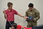 Dr. Dan Cushman (University of Utah) and Sgt. Lopez (WRAIR-West) demonstrate how to use an ultrasound in an ultrasound training session hosted by WRAIR-West for Holistic Health and Fitness. (Photo Credit: Sean Hall)