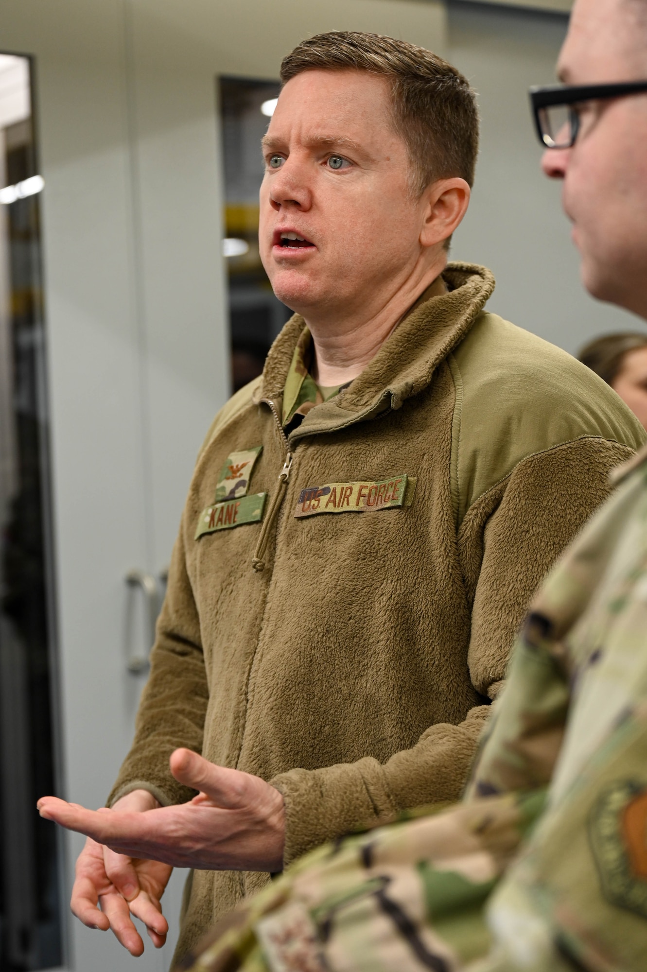 Col. Jason Kane asks a question during a tour