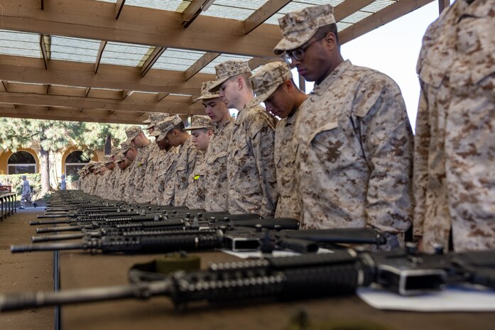 U.S. Marine Corps recruits with Delta Company, 1st Recruit Training Battalion, wait for instruction before an M16A4 service rifle issue at Marine Corps Recruit Depot San Diego, California, Jan. 13, 2025. Recruits were issued rifles and briefed on their responsibilities regarding rifle security, safety and handling. Marines are warfighters first, and always. Every Marine is a rifleman, and a Marine officer is a rifle platoon commander. This unique characteristic distinguishes Marines from all services, at home and abroad. (U.S. Marine Corps photo by Lance Cpl. Jacob B. Hutchinson)