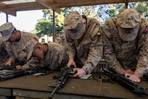 U.S. Marine Corps recruits with Delta Company, 1st Recruit Training Battalion, check their rifles during an M16A4 service rifle issue at Marine Corps Recruit Depot San Diego, California, Jan. 13, 2025. Recruits were issued rifles and briefed on their responsibilities regarding rifle security, safety and handling. Marines are warfighters first, and always. Every Marine is a rifleman, and a Marine officer is a rifle platoon commander. This unique characteristic distinguishes Marines from all services, at home and abroad. (U.S. Marine Corps photo by Lance Cpl. Jacob B. Hutchinson)