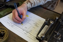 A U.S. Marine Corps recruit with Delta Company, 1st Recruit Training Battalion, signs paperwork for their rifle during an M16A4 service rifle issue at Marine Corps Recruit Depot San Diego, California, Jan. 13, 2025. Recruits were issued rifles and briefed on their responsibilities regarding rifle security, safety and handling. Marines are warfighters first, and always. Every Marine is a rifleman, and a Marine officer is a rifle platoon commander. This unique characteristic distinguishes Marines from all services, at home and abroad. (U.S. Marine Corps photo by Lance Cpl. Jacob B. Hutchinson)