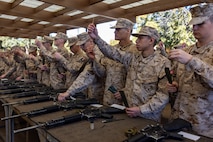 U.S. Marine Corps recruits with Delta Company, 1st Recruit Training Battalion, inventory their rifle cleaning kits during an M16A4 service rifle issue at Marine Corps Recruit Depot San Diego, California, Jan. 13, 2025. Recruits were issued rifles and briefed on their responsibilities regarding rifle security, safety and handling. Marines are warfighters first, and always. Every Marine is a rifleman, and a Marine officer is a rifle platoon commander. This unique characteristic distinguishes Marines from all services, at home and abroad. (U.S. Marine Corps photo by Lance Cpl. Jacob B. Hutchinson)