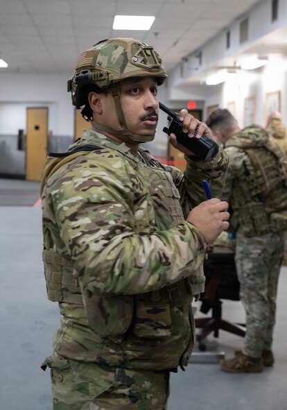 U.S. Air Force Staff Sgt. Charles Borden, 91st Missile Security Forces Squadron Defender, helps facilitate communication to the airmen during an exercise and direct the teams’ departure to a Missile Alert Facility (MAF) at Minot Air Force Base, North Dakota, Jan. 14, 2025. The exercise provided Airmen the opportunity to test their knowledge and practice for an assault on a MAF. (U.S. Air Force photo by Airman 1st Class Wesley Davies)