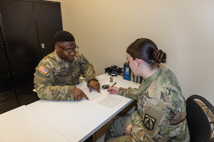 U.S. Army Spc. Amanda Pinkston, assessor, Walter Reed Army Institute of Research (WRAIR)-West, and U.S. Army Sgt. Michael Bourguillon, participant, WRAIR-West, take part in the survey and timed response portion of a study on brain health and PTSD at the Intrepid Spirit Center, Joint Base Lewis-McChord, Washington, September 30, 2024. The study, which is a collaboration between WRAIR-West and the University of Pittsburgh’s Concussion Research Lab, aims to understand occupation-related chronic repeated head injury (RHI) exposure and brain health, as well as to identify prognostic biological and clinical markers of chronic repetitive mild traumatic brain injury (mTBI) and military occupational specialty (MOS)-related RHI exposure. 

(U.S. Army photo by Christopher Nititham and Hannah Covington/RELEASED)