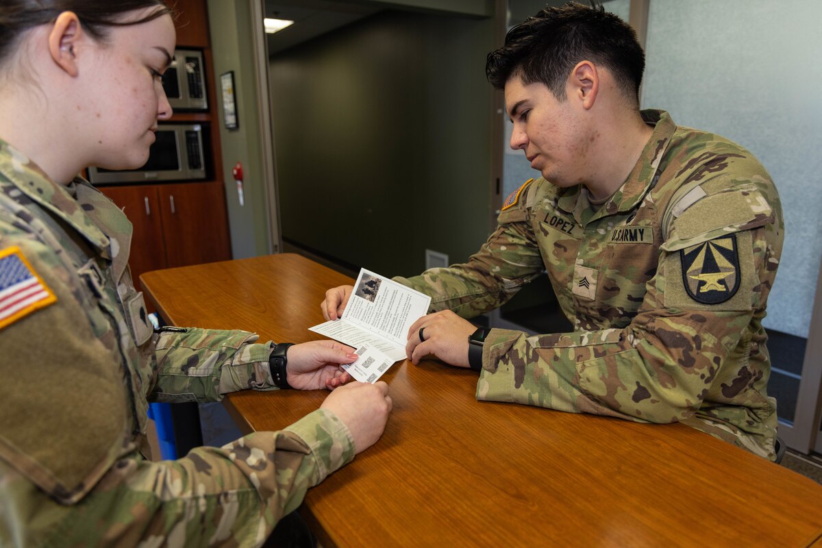 U.S. Army Sgt. Brenden Lopez, Walter Reed Army Institute of Research (WRAIR)-West, uses a resource brochure as a conversation aid with U.S. Army Spc. Amanda Pinkston, WRAIR-West, as part of Peer Advisor Training at WRAIR-West on Joint Base Lewis-McChord, Washington, October 1, 2024. The Peer Advisor Training enables individual service members to be well-versed in the variety of services provided by the military, and encourages them to provide information on those services to their squad or unit.

(U.S. Army photo by Christopher Nititham and Hannah Covington/RELEASED)