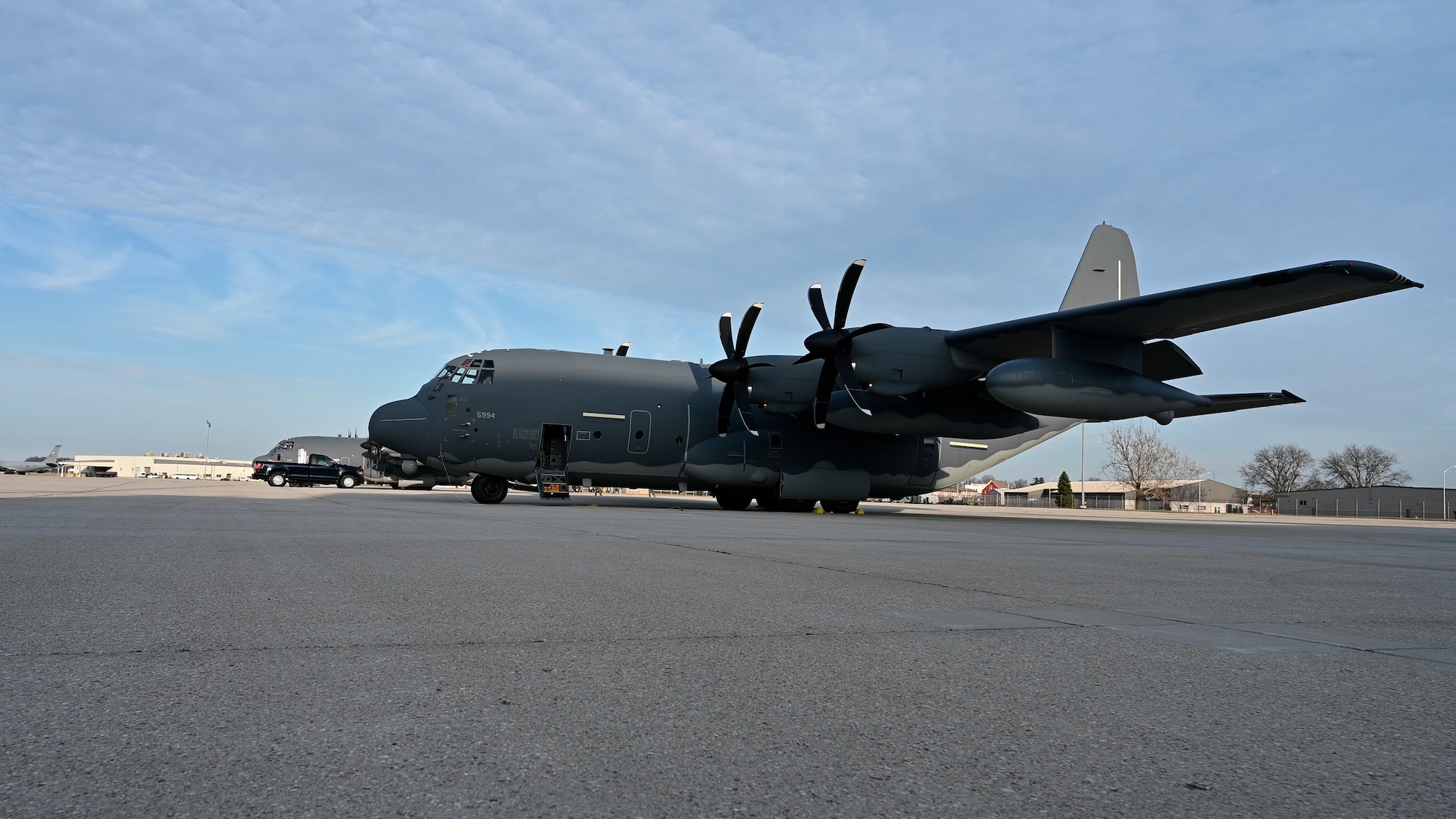 A MC-130J plane on a tarmac.