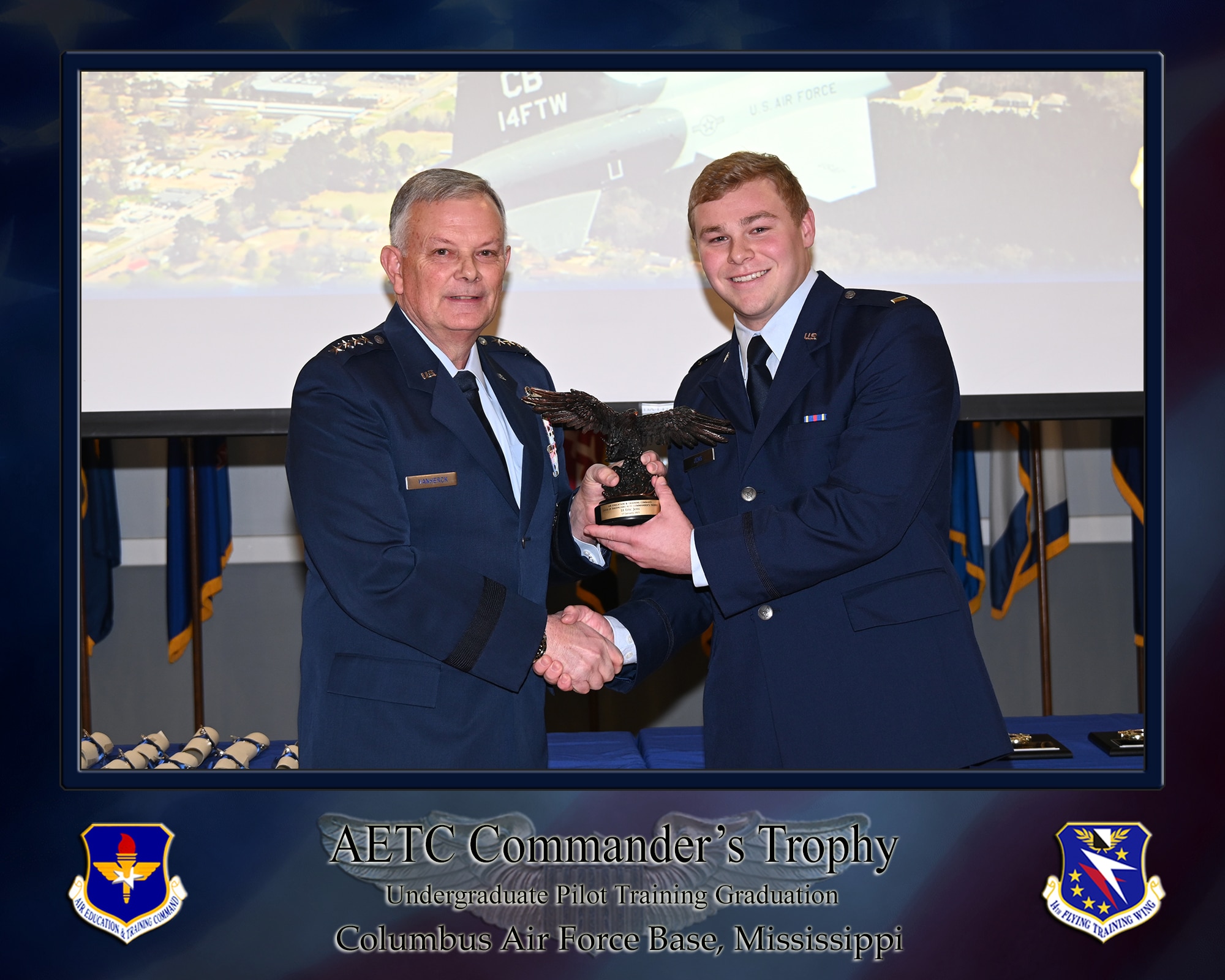 Undergraduate Pilot Training Class 25-04 graduation speaker General (Ret) Glen D. VanHerck and 2nd LT Eric J. Jens, pose for a photo with the Air Education and Training Command commander’s trophy during the official graduation ceremony on January 17, 2024, at the Columbus Events Center on Columbus Air Force Base, Mississippi. Jens was also recognized as the Distinguished Graduate, receiving the Distinguished Graduate Award, along with the Flying Training Award. (U.S. Air Force photo by Melissa Duncan-Doublin)