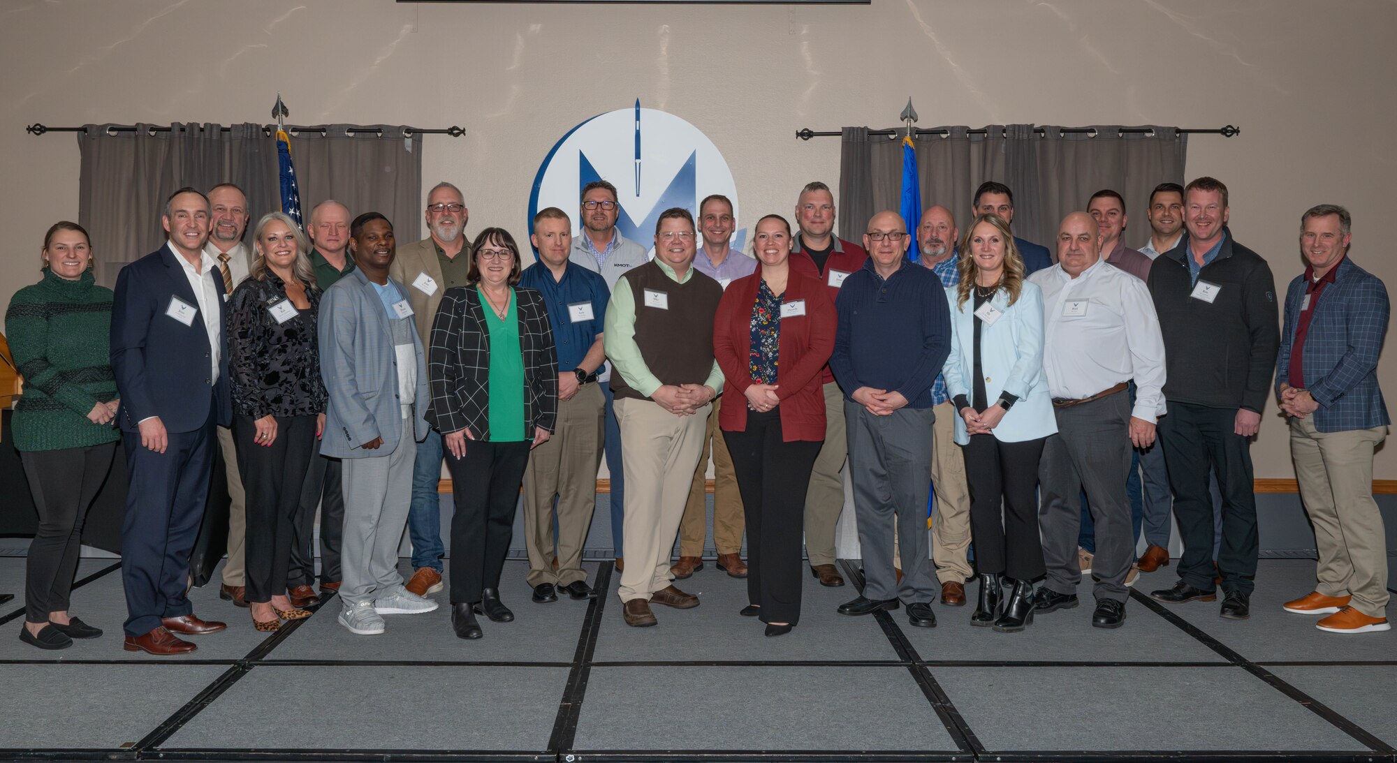 Team Minot leaders and newly inducted honorary commanders pose for a photo at Minot Air Force Base, North Dakota, Jan. 15, 2025. The honorary commander program aims to connect Team Minot leaders with leaders from the local community to foster mutual support, partnership, and awareness of Team Minot's mission. (U.S. Air Force photo by Senior Airman Kyle Wilson)