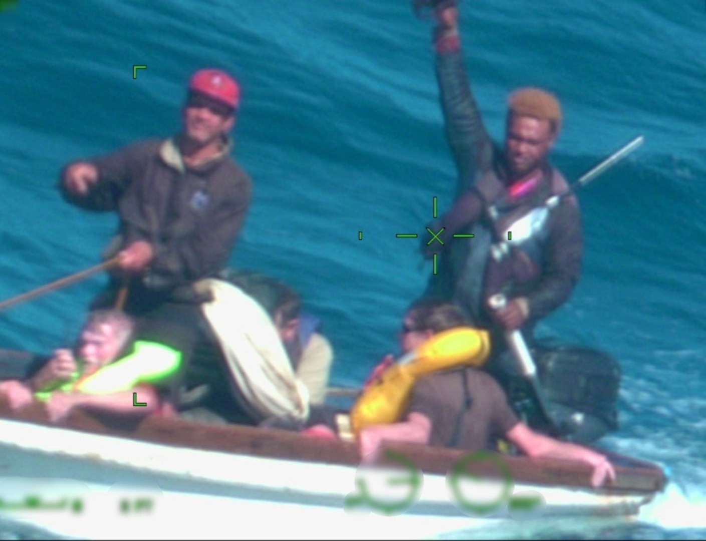 Fishermen from the fishing vessel Bonanza transport four survivors, U.S. citizens, to the container ship Coqui after rescuing them, with the assistance of a Coast Guard aircrew, from a life raft in the Atlantic Ocean north of Dominican Republic, Jan. 21, 2025. The survivors are U.S. boaters who were forced to abandon the sailing vessel Mariposa after it sank in the Silver Bank area. (U.S. Coast Guard photo)