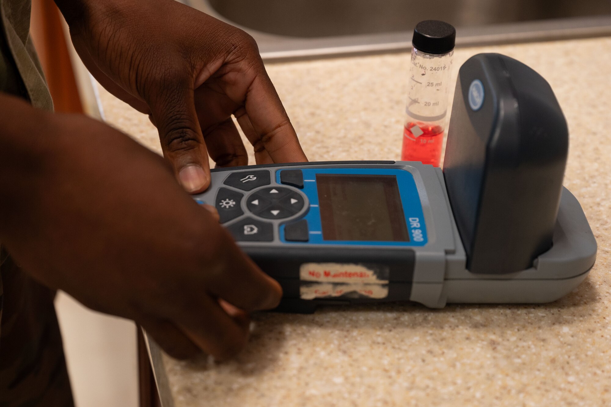 U.S. Air Force Senior Airman Ladarius Musonda, 36th Operational Medical Readiness Squadron bioenvironmental engineering journeyman, uses a DR900 water analyzer to test drinking water at Andersen Air Force Base, Guam, Jan. 22, 2025. The bioenvironmental team conducted a lead service line inventory to review and confirm that there is no lead in any service lines on base.