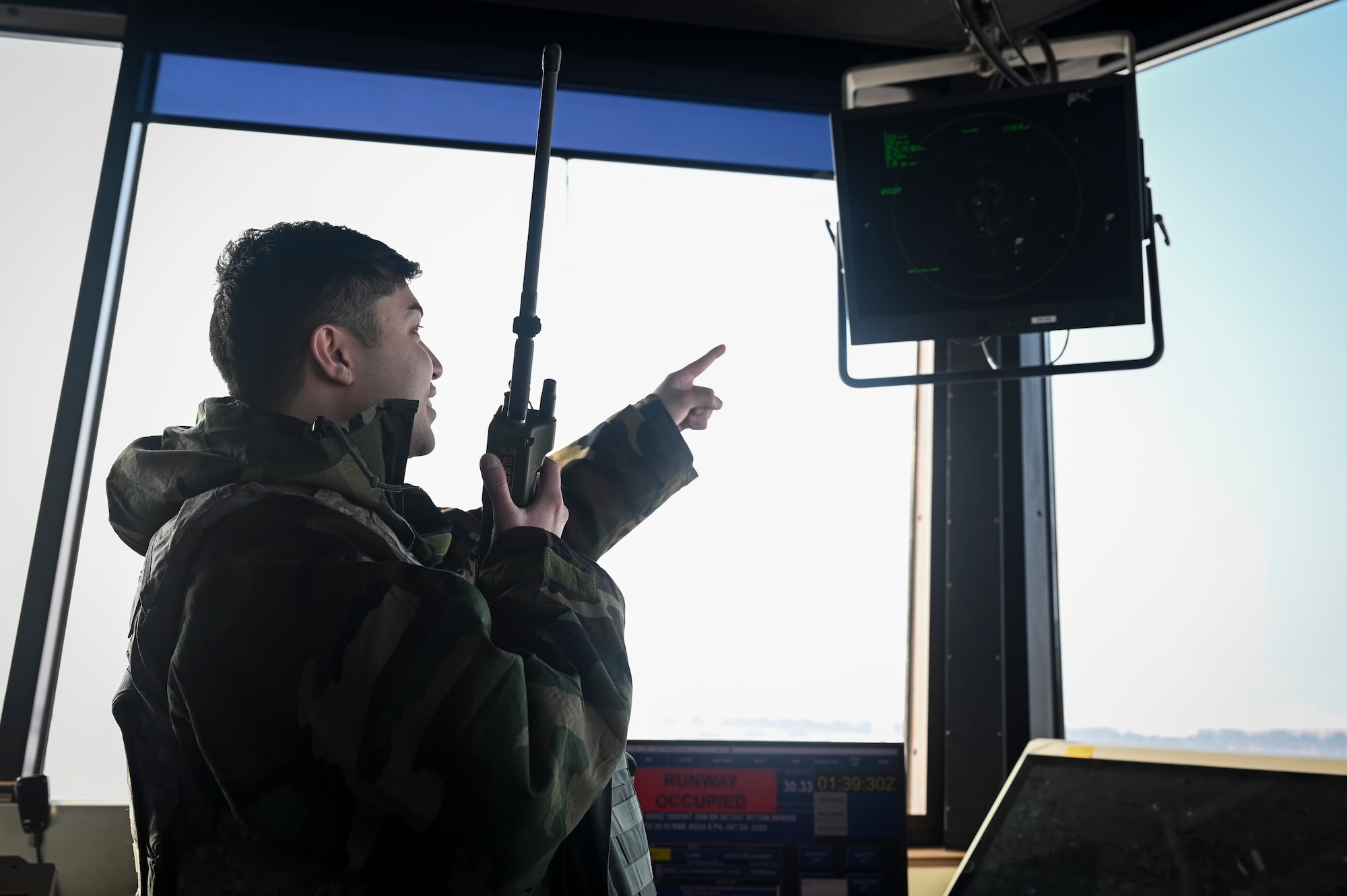 Senior Airman Tyler Aguon, 8th Operation Support Squadron air traffic control tower trainer, monitors the tower display workstation during Beverly Pack 25-1.