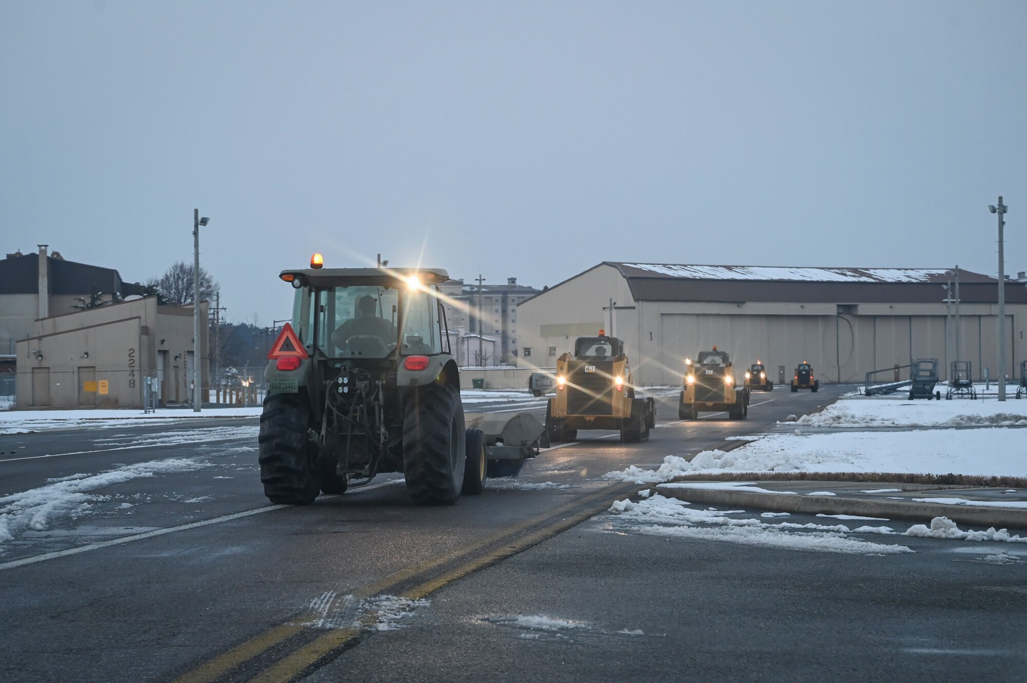 Airmen assigned to the 8th Fighter Wing utilize heavy equipment to remove snow from the flight line during Beverly Pack 25-1.