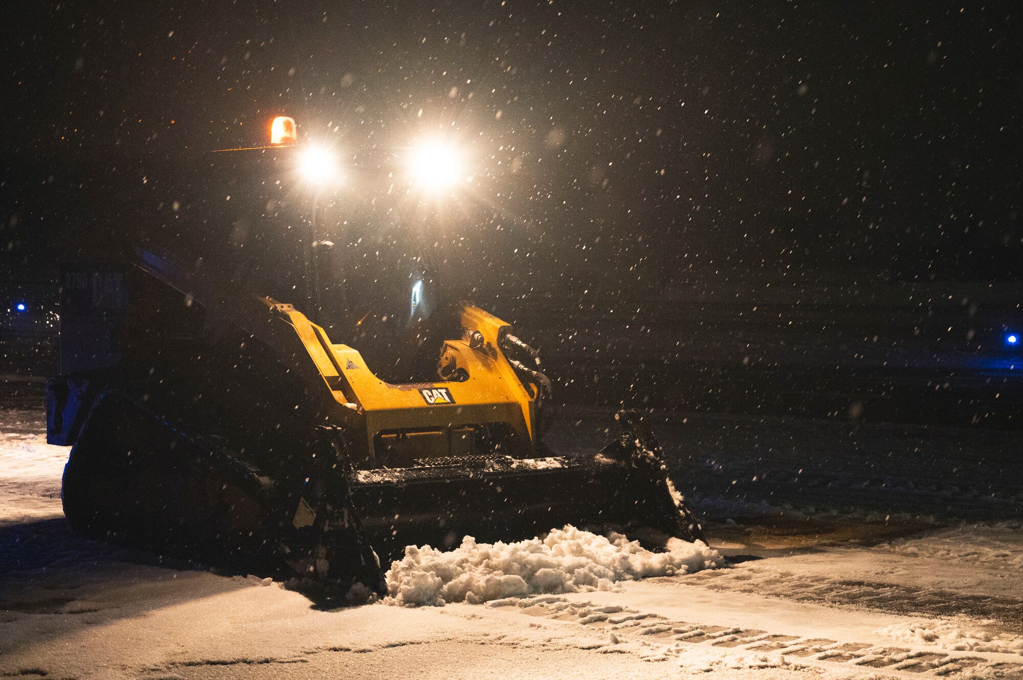 Senior Airman Joseph Parmer, 8th Civil Engineering Squadron pavement and equipment operator, operates a compact track loader on the flightline.