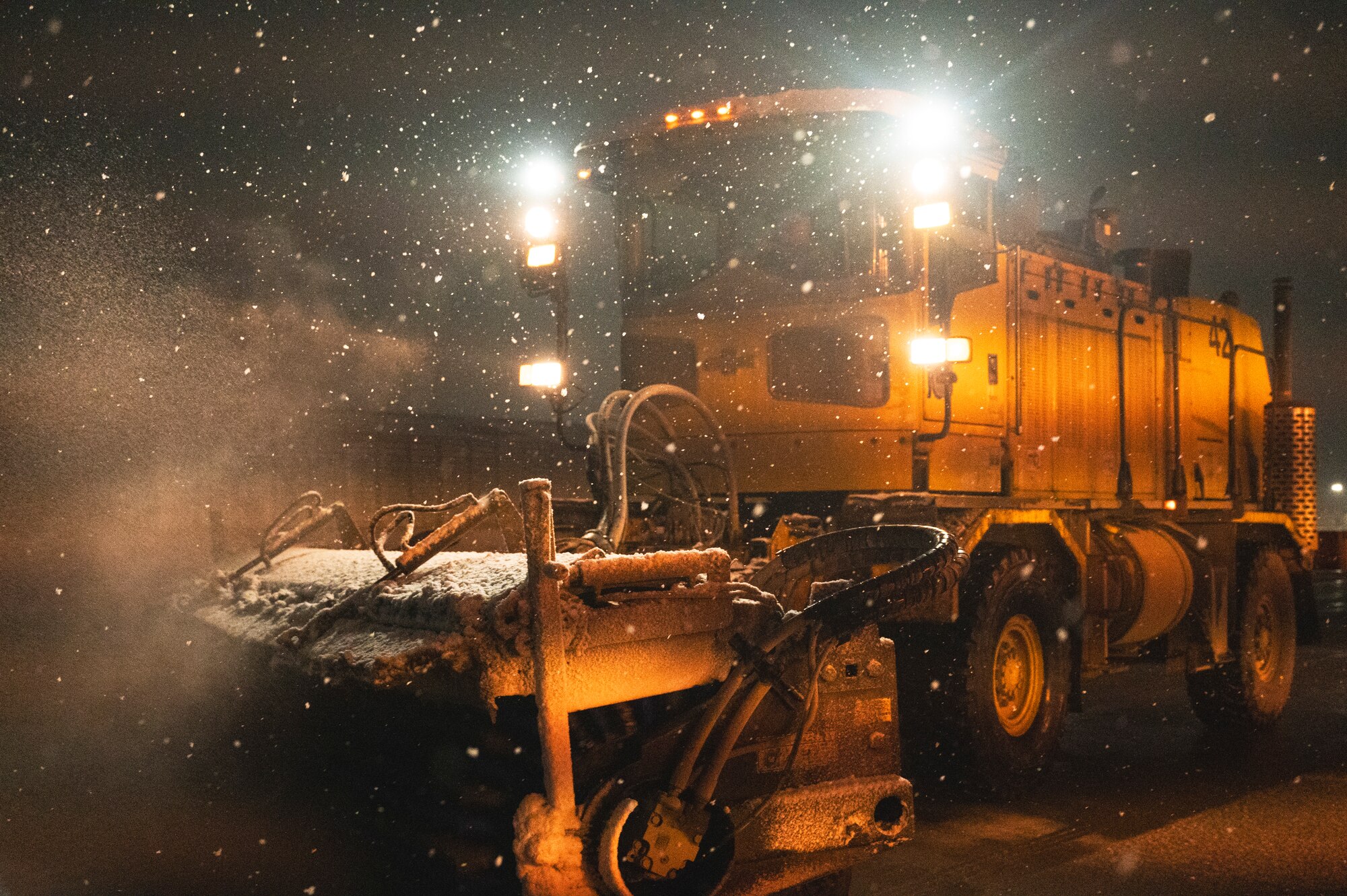 U.S. Air Force Staff Sgt. Adam Backus, 8th Civil Engineering Squadron pavement and equipment operator, utilizes an Oshkosh broom to clear the taxiway on the flightline