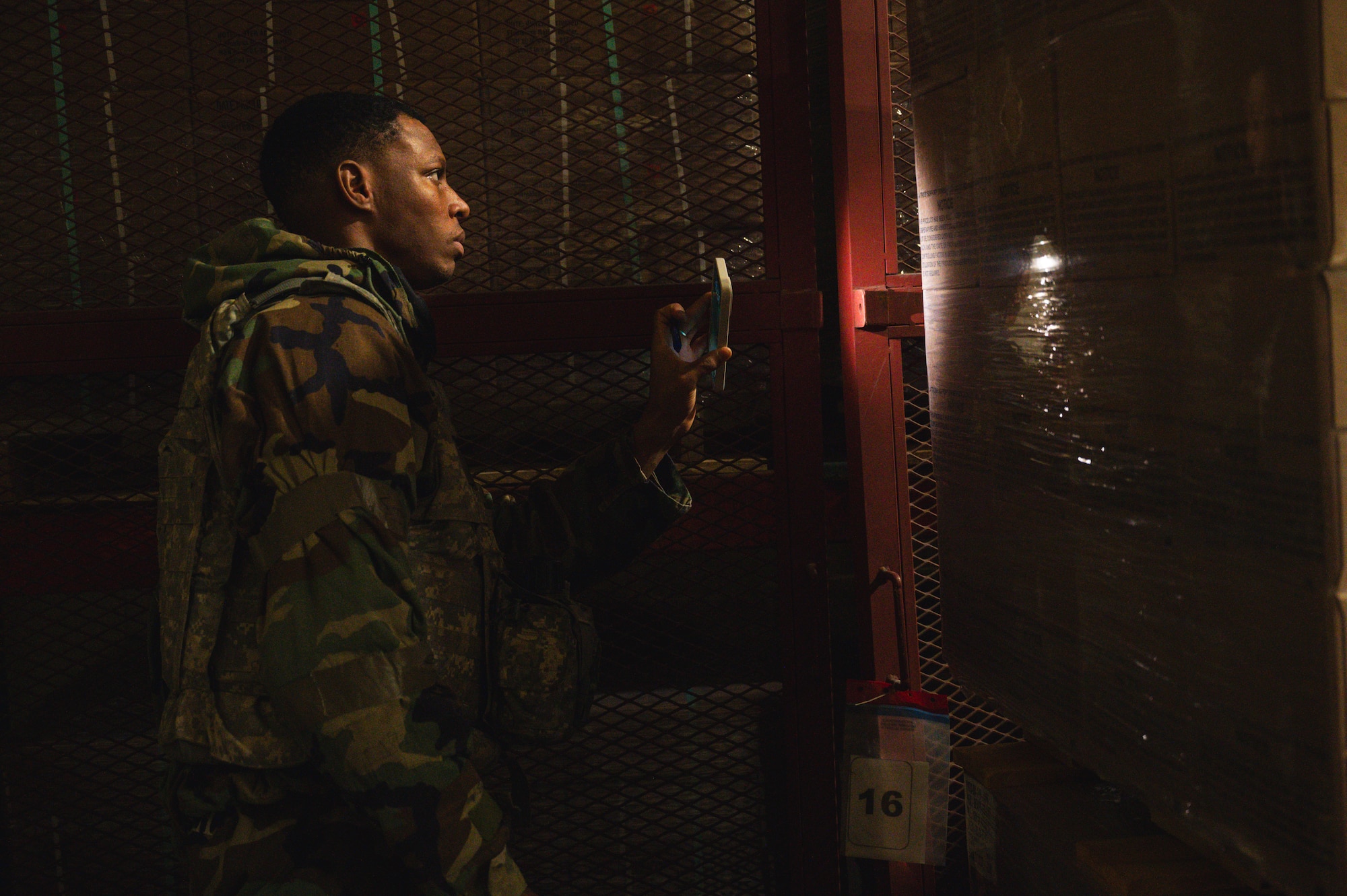 Senior Airman OShane Williams, 8th Operational Medical Readiness Squadron public health technician, inspects meal ready-to-eat pallets for contaminants.
