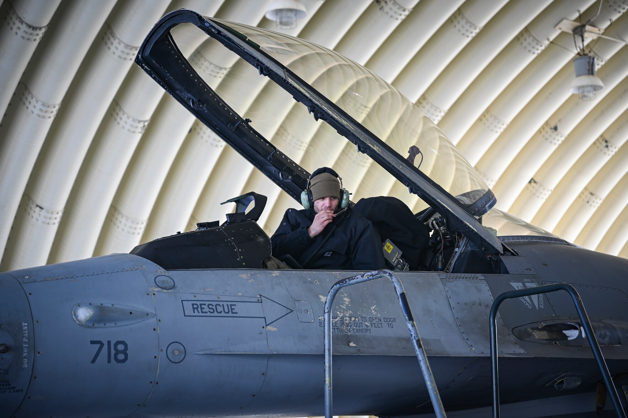 U.S. Air Force Staff Sgt. Caleb Reyes, 35th Fighter Generation Squadron weapons load crew team chief, conducts a maintenance inspection on an F-16 Fighting Falcon aircraft.