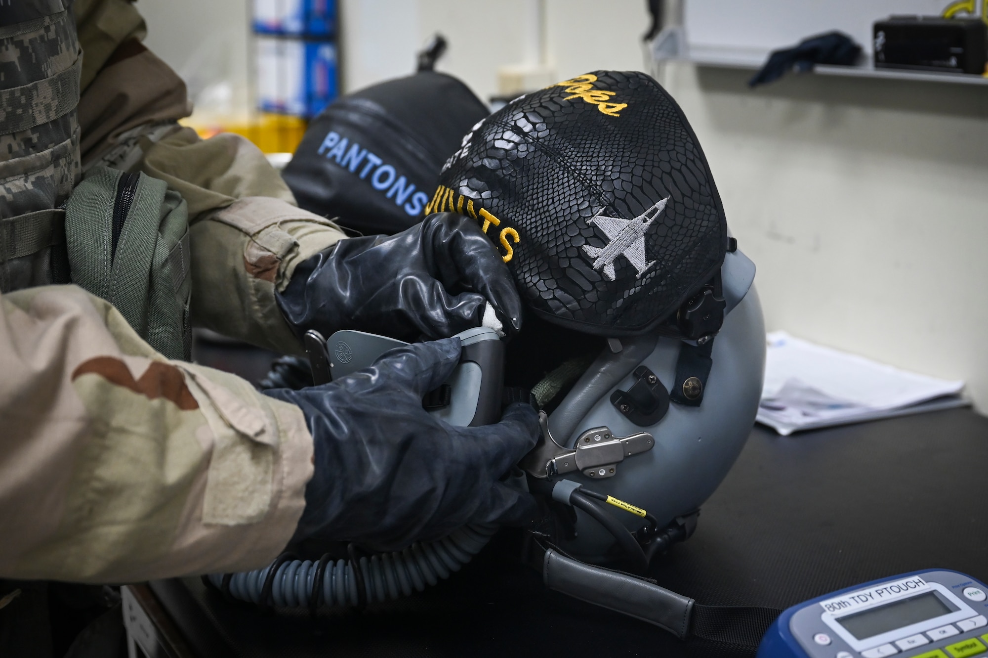 Senior Airman Jonathan Bender, 8th Operations Support Squadron aircrew flight equipment journeyman, sanitizes a pilot’s helmet during Beverly Pack 25-1.