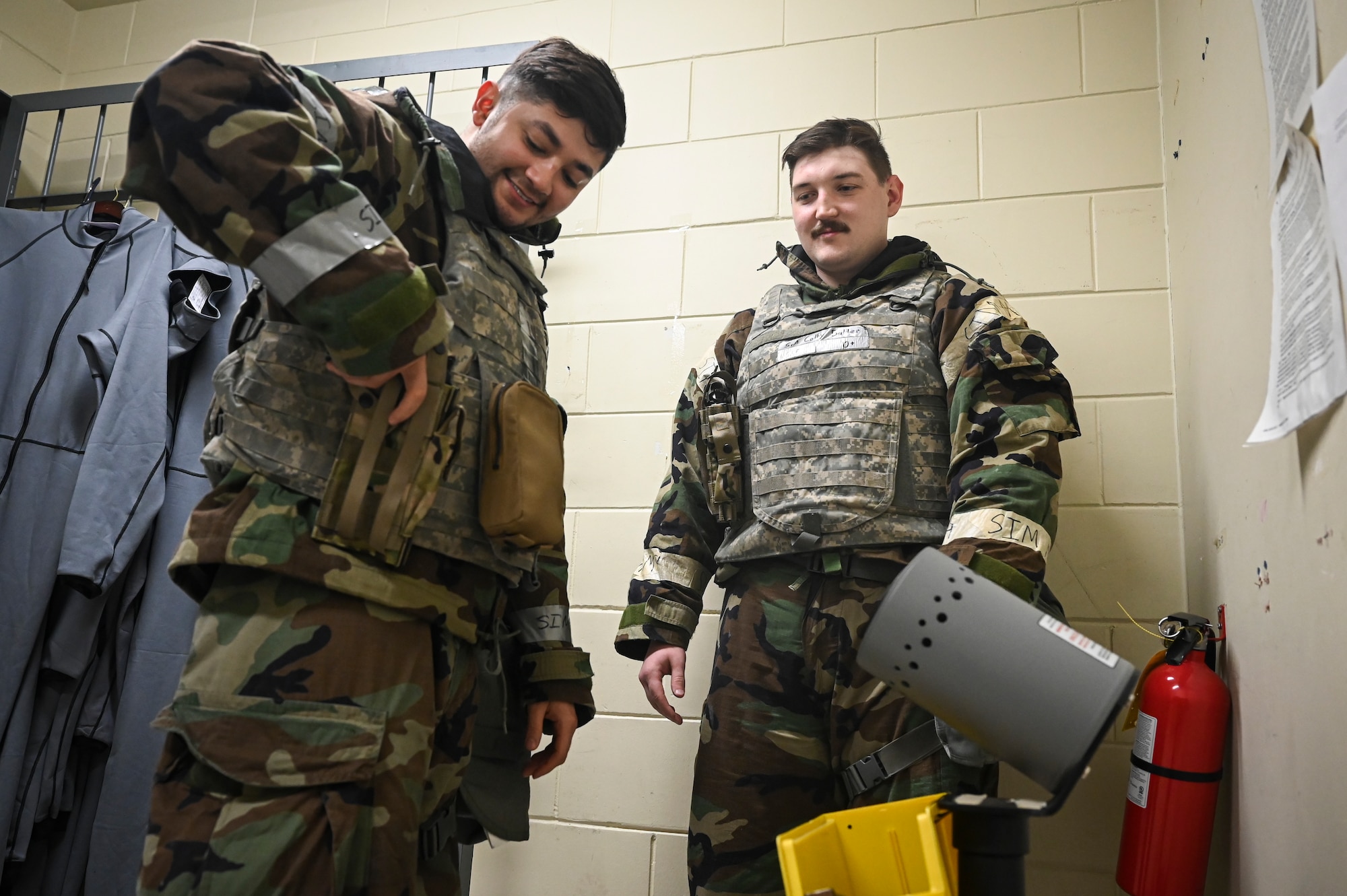 U.S. Air Force Staff Sgt. Justin Viray, left, 8th Operation Support Squadron aircrew flight equipment non-commissioned officer in charge, conducts general arming procedures with Senior Airman Jonathan Bender, 8th Operations Support Squadron aircrew flight equipment journeyman, during Beverly Pack 25-1.