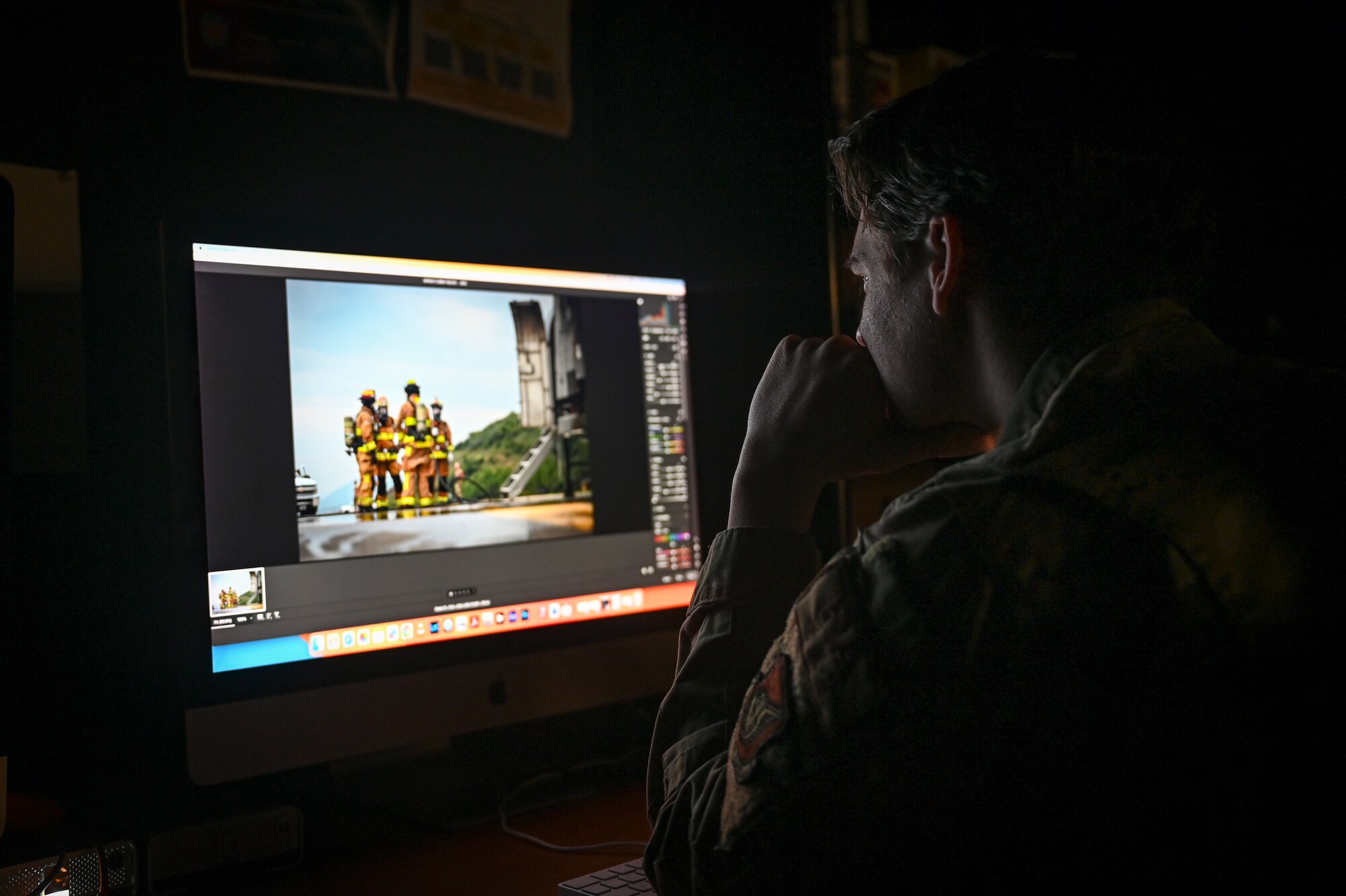 Senior Airman James Johnson, 8th Fighter Wing public affairs journeyman, edits a photo.