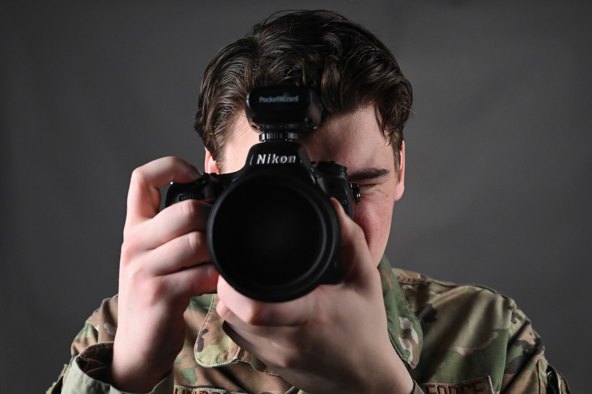 Senior Airman James Johnson, 8th Fighter Wing public affairs journeyman, takes a photo.