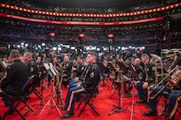 band members are seated waiting to perform