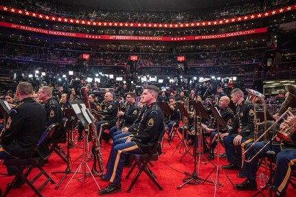 band members are seated waiting to perform