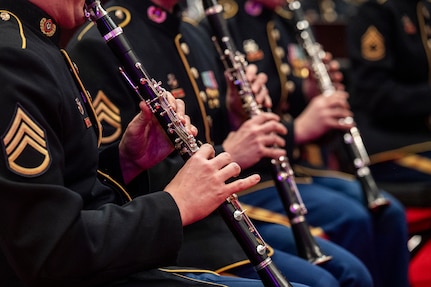 close up shot of musicians playing wind instruments