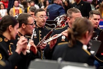 Band members performing with wind instruments