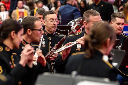 Band members performing with wind instruments