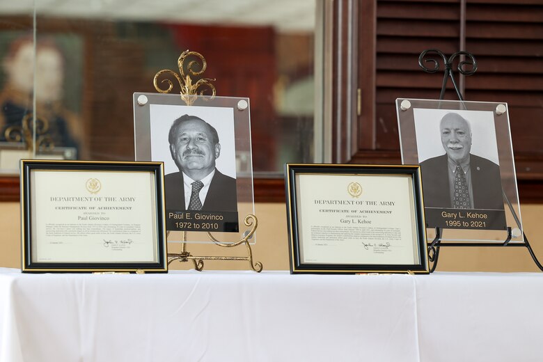 ) Award citations for Gary L. Kehoe and Paul Giovinco sit on display during an all-hands ceremony at the Fort Hamilton Community Club in Brooklyn, New York. During the event, Kehoe and Giovinco were inducted into the U.S. Army Corps of Engineers, North Atlantic Division Gallery of Distinguished Civilians by Brig. Gen. John P. Lloyd, NAD commander and division engineer, becoming the 26th and 27th inductees selected for the honor since the gallery’s inception in the mid-1900s.