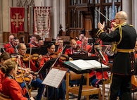 A music conductor leads an ensemble