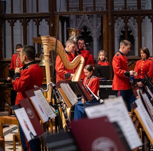 Band members move around seats getting equipment ready