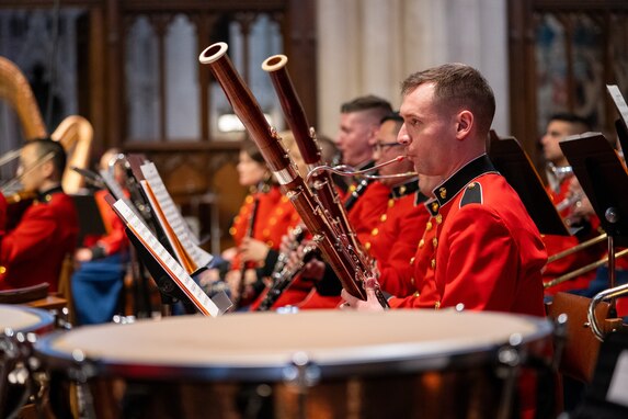 A band member performs on their instrument