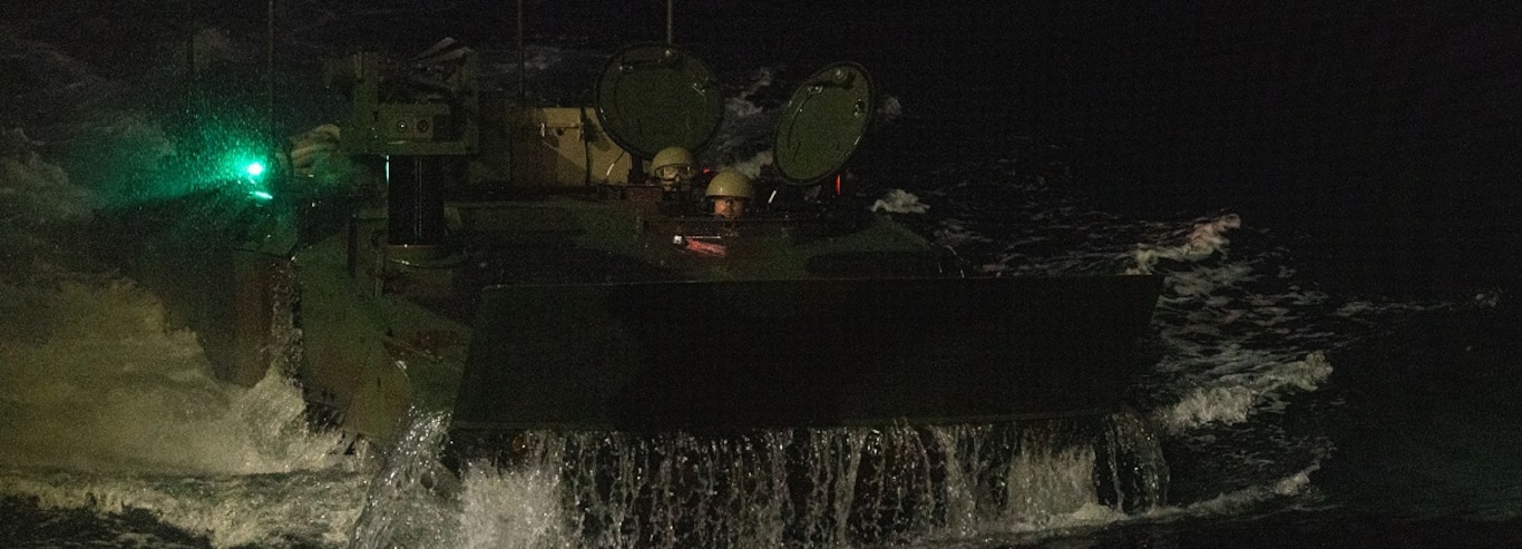 U.S. Marines Amphibious Combat Vehicles embark from open water onto the USS Rushmore (LSD-47) during naval integration operations at Fleet Activities Sasebo, Japan, Jan. 16, 2025.
