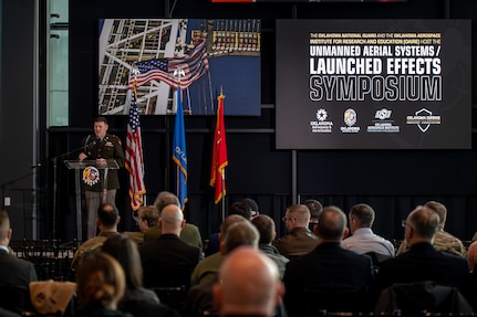 Col. Shane Riley, director, Oklahoma National Guard Unmanned Aerial Systems and Launched Effects Program, welcomes attendees to the second annual OKNG UAS/LE Symposium at the Oklahoma State University Hamm Institute for American Energy in Oklahoma City, Jan. 21, 2025. Topics at the symposium included emerging UAS threats, Department of Defense and National Guard integration in advanced air mobility, maneuver training, integrating UAS in interagency operations, and counter-UAS initiative development. (Oklahoma National Guard photo by Anthony Jones)