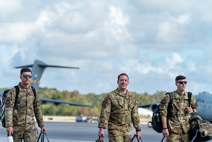 men walk on flightline