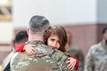 girl hugs father