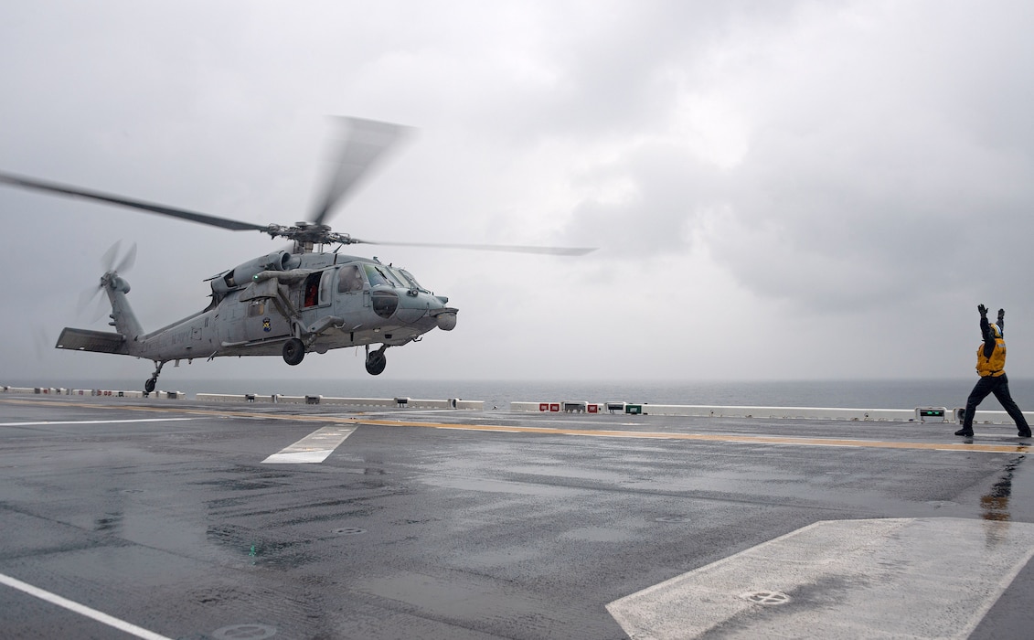 HSC-25 conducts flight operations aboard USS America (LHA 6) in the Philippine Sea.