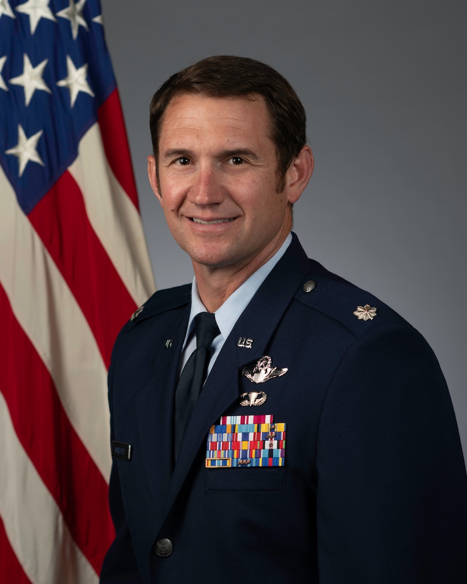 An official photo of Lt Col Marcotte in front of a US flag