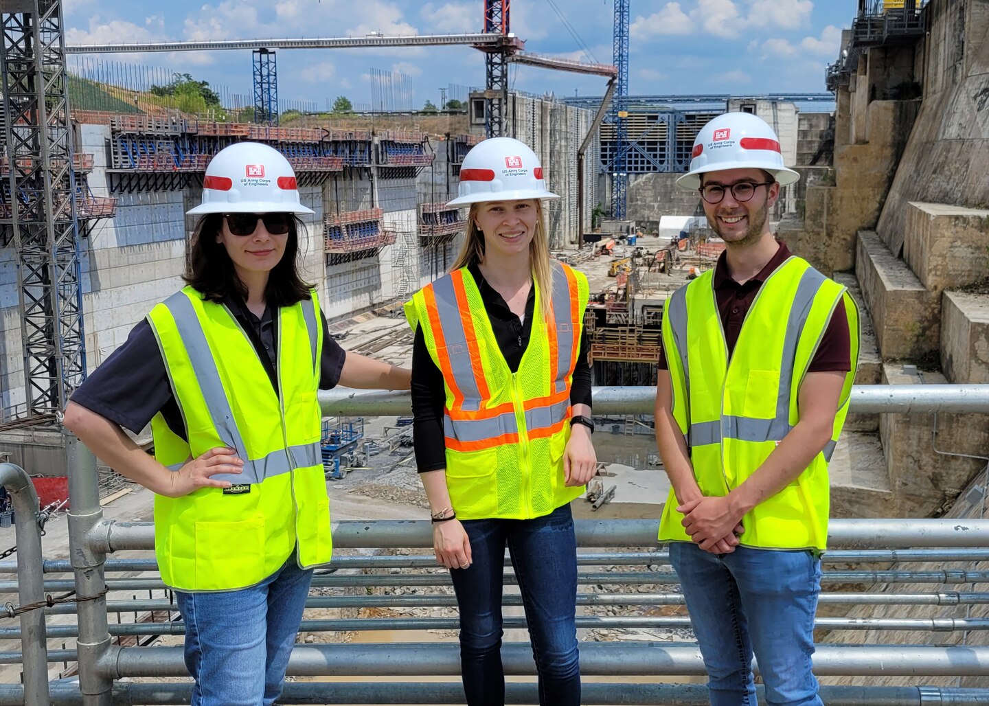 Assistant District Counsel Kathryn Morris (Left) poses with Anna Kjems, jurisprudence degree candidate, and Kyle Blasinsky, jurisprudence degree and doctorate candidate, during a tour of the Kentucky Lock Addition Project on the Tennessee River in Grand Rivers, Kentucky. The student interns attend Vanderbilt University in Nashville, Tennessee. Morris is the U.S. Army Corps of Engineers Nashville District Employee of the Month for November 2024. (USACE Photo)