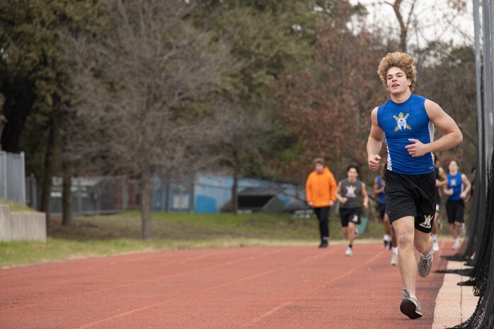 A student with Anderson High School, conducts an one and a half mile run during the Initial Strength Assessment at Anderson High School in Austin, Texas, Jan. 15, 2025. During the visit, Marines hosted an Initial Strength Assessment with Anderson High School students. (U.S. Marine Corps photo by Cpl. Jose D. Cruz)
