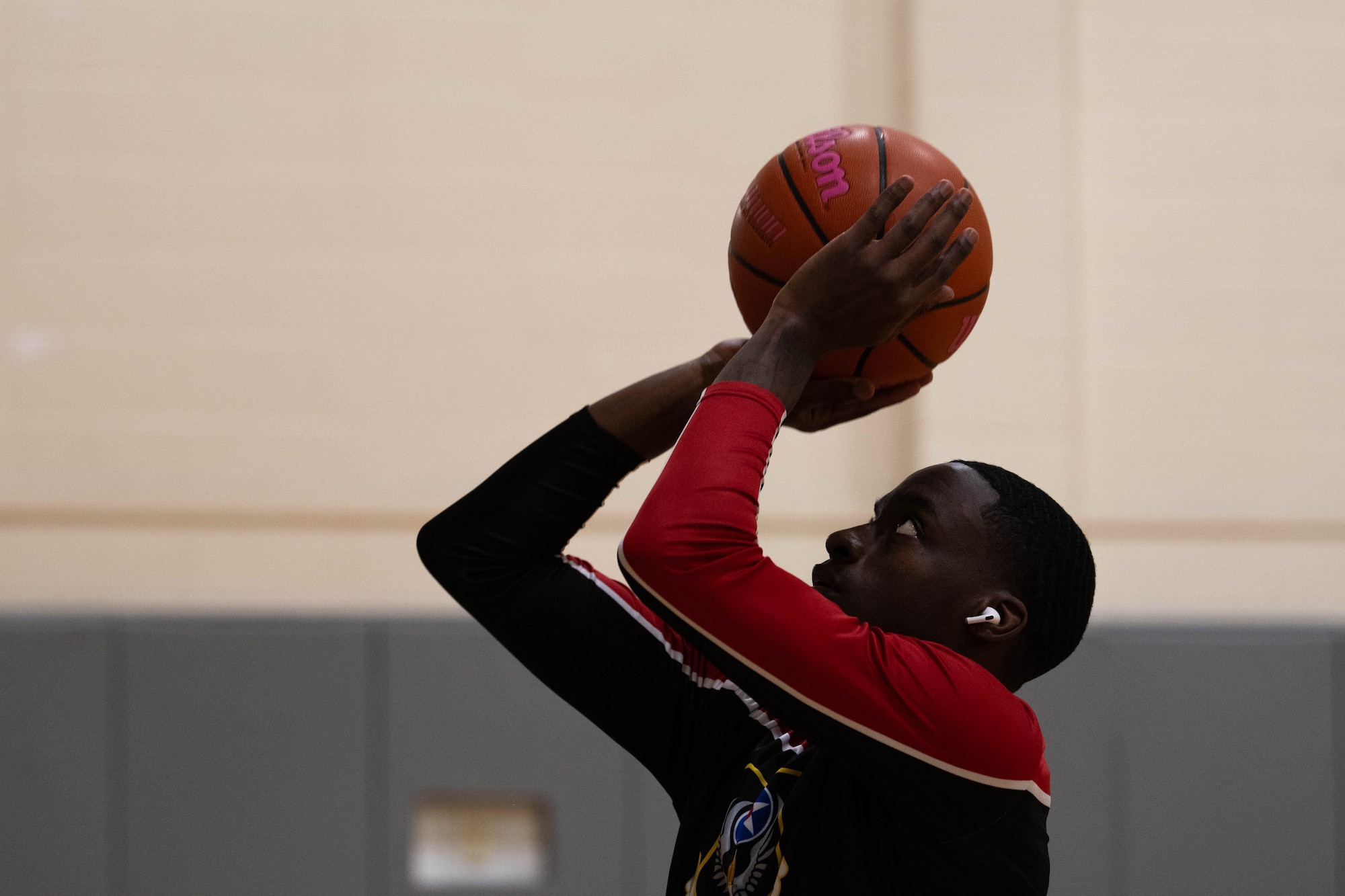 A U.S. Airman with the Hurlburt Field Air Commandos basketball team aims their shot at Hurlburt Field, Florida, Jan. 10, 2025.